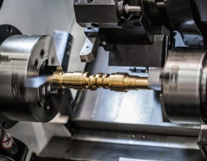 Metalworking CNC milling lathe machine. Cutting metal modern processing technology. Small depth of field. Warning - authentic shooting in challenging conditions. A little bit grain and maybe blurred.